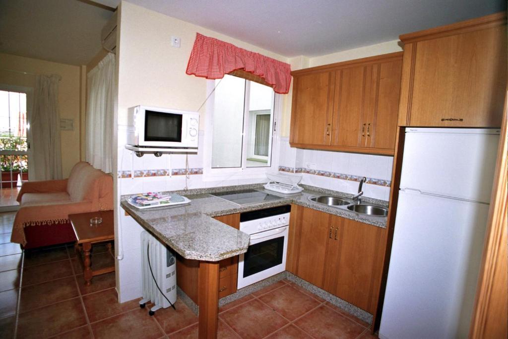 Apartamentos La Casa Del Barrio Маро Номер фото